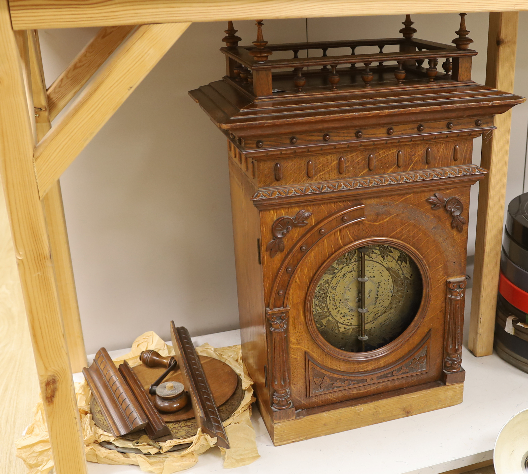 An oak cased penny operated polyphon (a.f.), with one 12 inch disc, dimensions; 76cm high, 52cm wide, 32cm deep